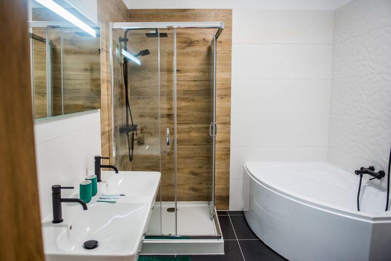 A bathroom with a shower cubicle and a corner bath