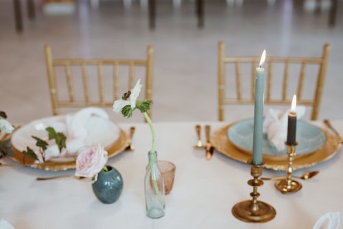 A table laid for an occasion party: candles and floral arrangements