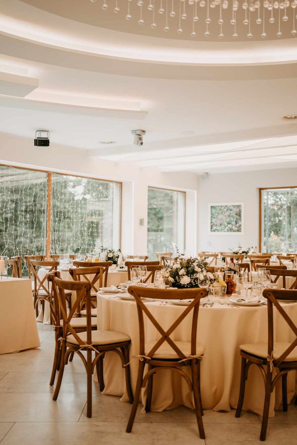 The Tarasowa hall with wooden chairs and windows onto the greenery